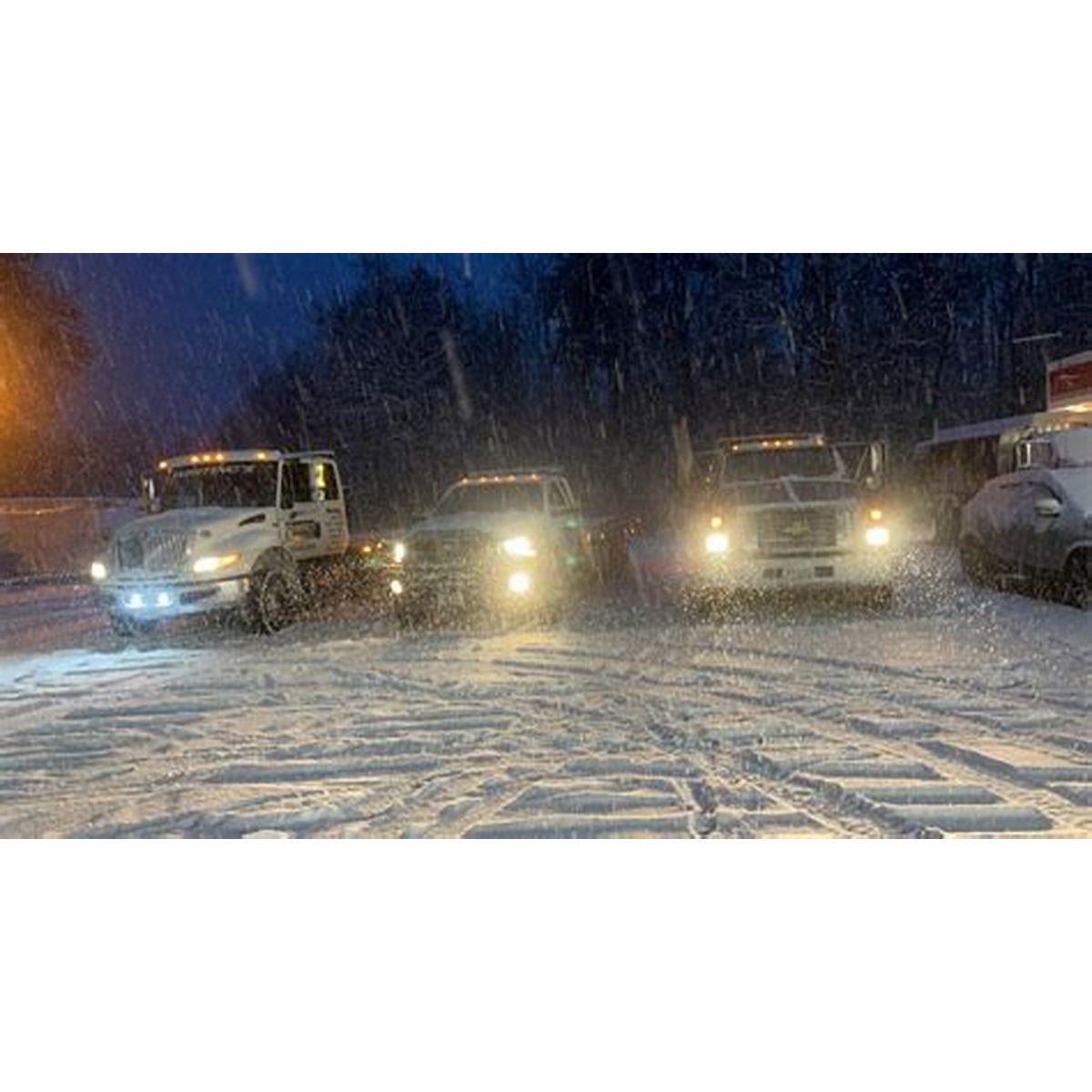 Whiting's tow trucks out in a New Hampshire snowstorm at night