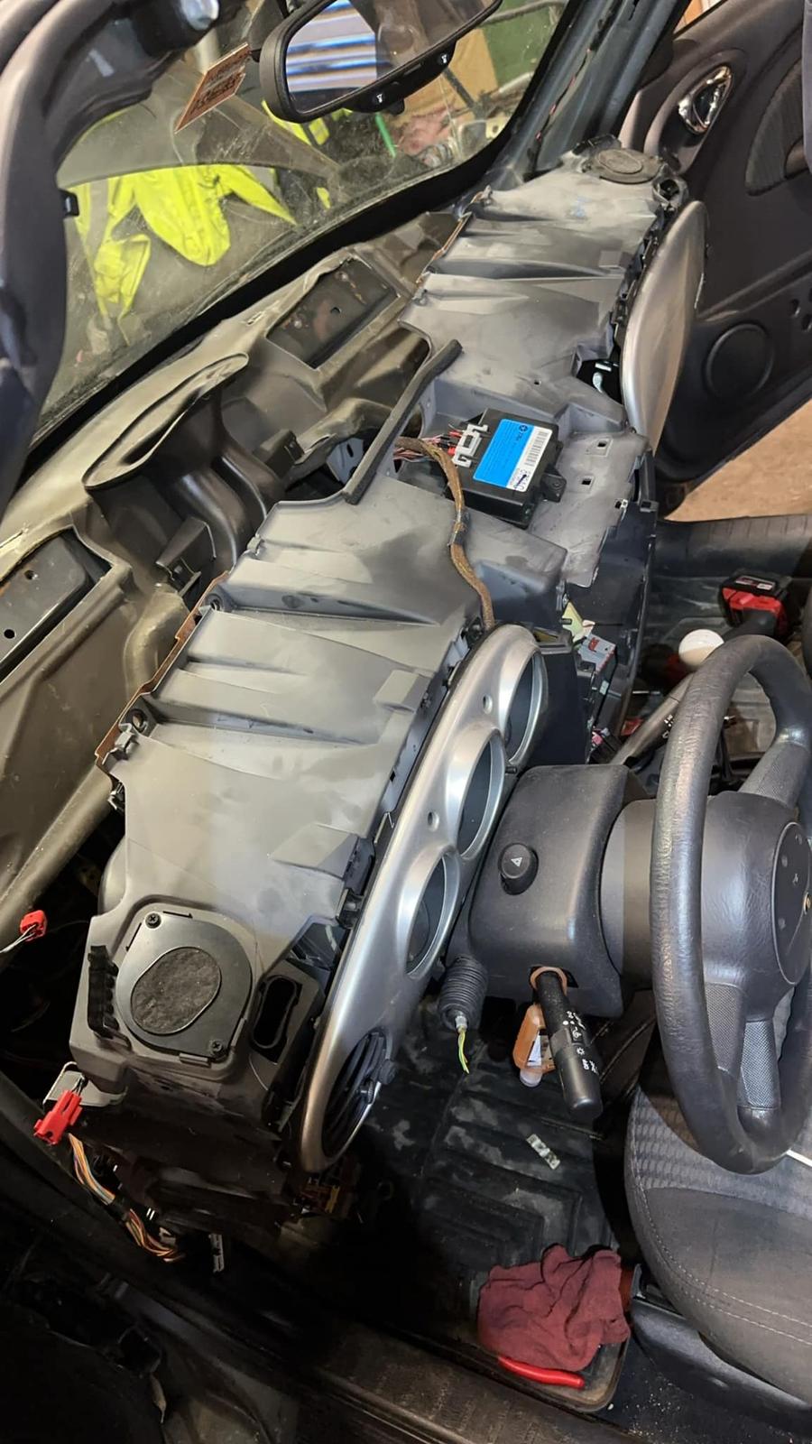 A MINI Cooper with the dashboard removed for a heater-core job at Whiting's